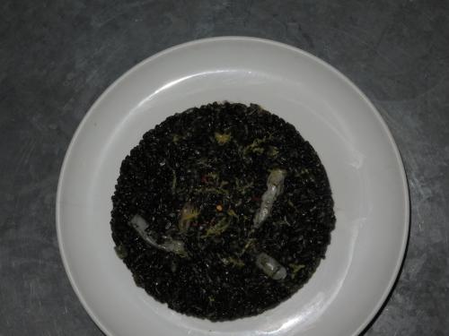 Fried arroz negro with squid and romesco Fried arroz negro with squid and romesco