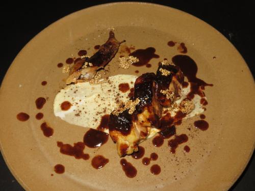 Grilled chicken wing with mole poblano and sesame Grilled chicken wing with mole poblano and sesame
