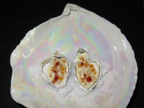 Kumamoto oyster with nixtamalized popcorn kernels Kumamoto oyster with nixtamalized popcorn kernels