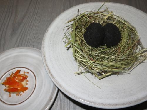 A small egg coated in ash, sauce made from dried trout and pickled marigold A small egg coated in ash, sauce made from dried trout and pickled marigold