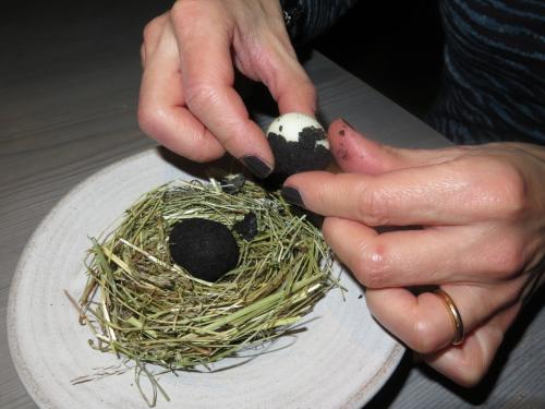 A small egg coated in ash, sauce made from dried trout and pickled marigold A small egg coated in ash, sauce made from dried trout and pickled marigold