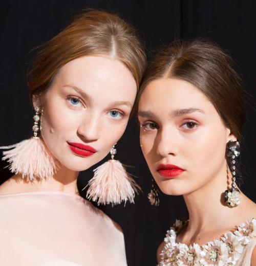 Classic red lips were given a modern twist at Badgley Mischka... The punchy colour was teamed with minimal, barely-there eyes which gave it the look an effortless edge.   Badgley Mischka - CosmopolitanUK